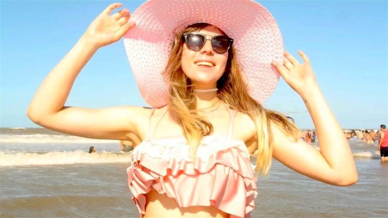 Woman wearing frilly pink bikini