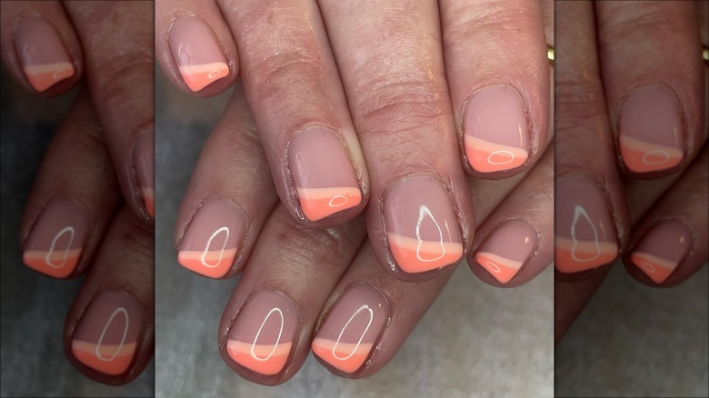 Orange-peach corner French manicure