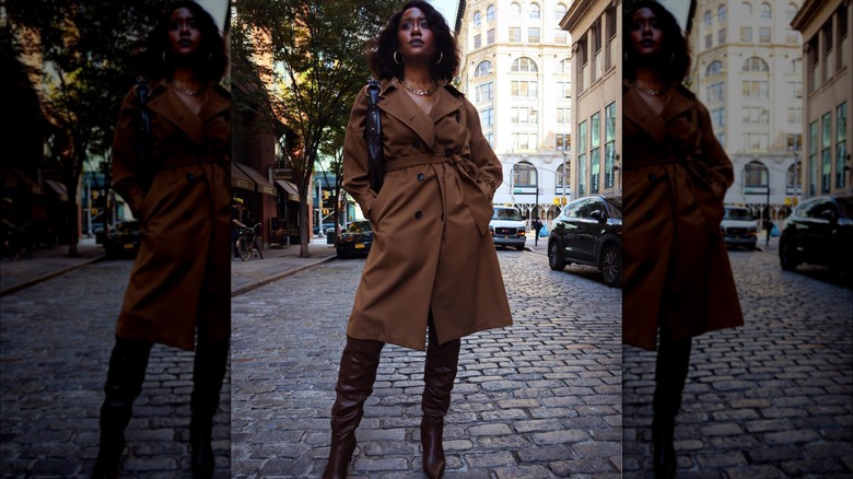 Woman wearing a tied trench coat as a dress.
