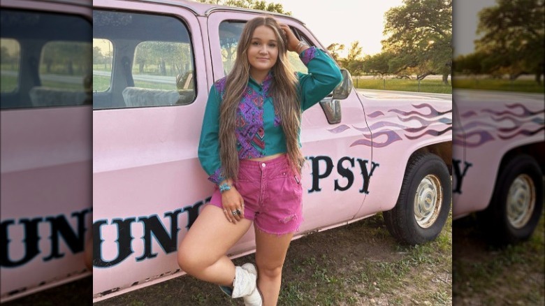 Woman in Western shirt, boots