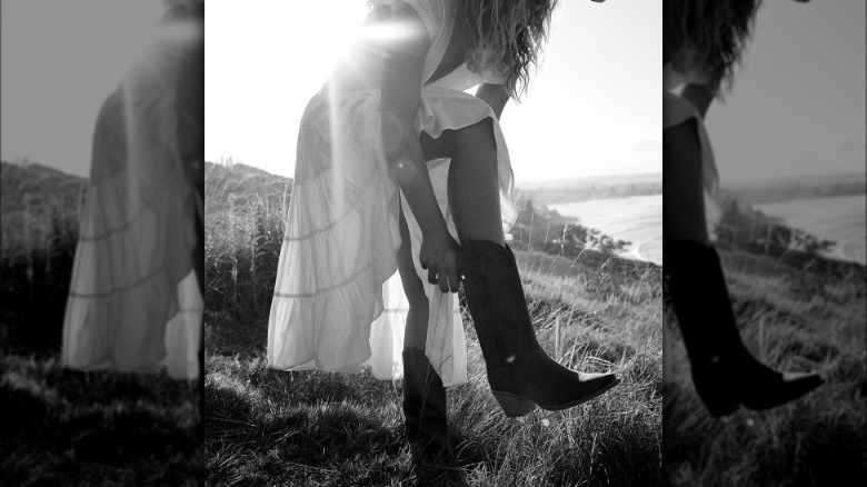 Model in cowboy boots, prairie dress