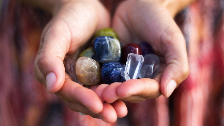 woman holding crystals