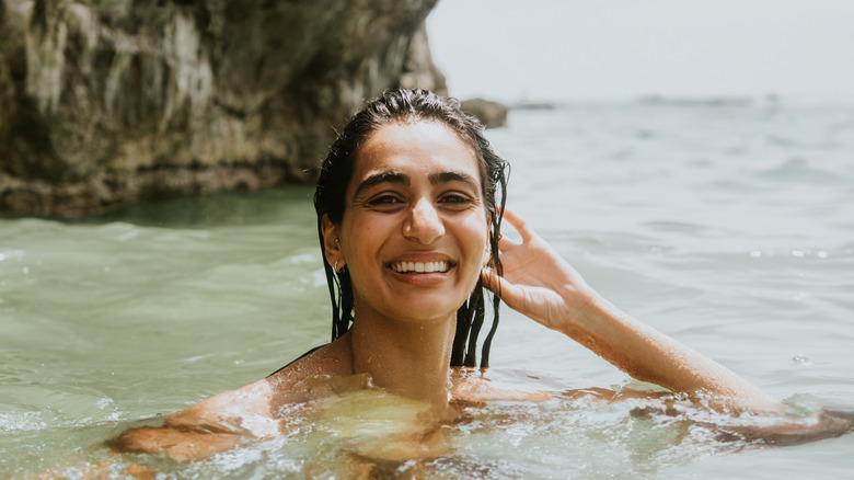 Woman smiling in the ocean