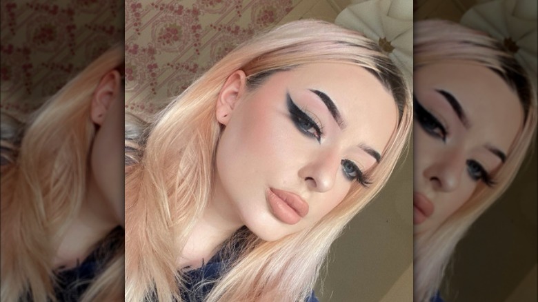 A woman with a dramatic winged eyeliner look