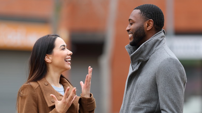 two people talking outside