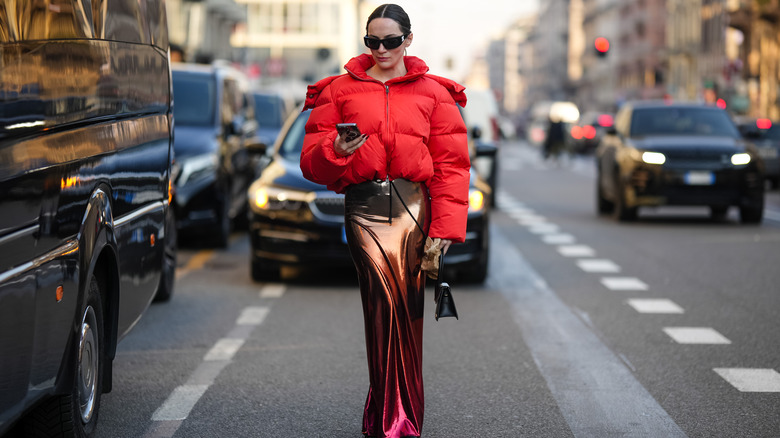 Woman wearing metallic maxi skirt