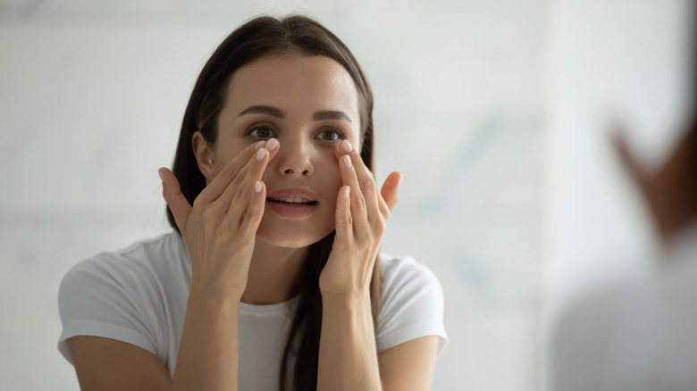 Woman massaging her eyes