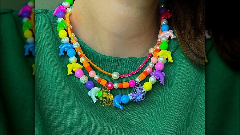 Person wearing colorful beaded necklace 