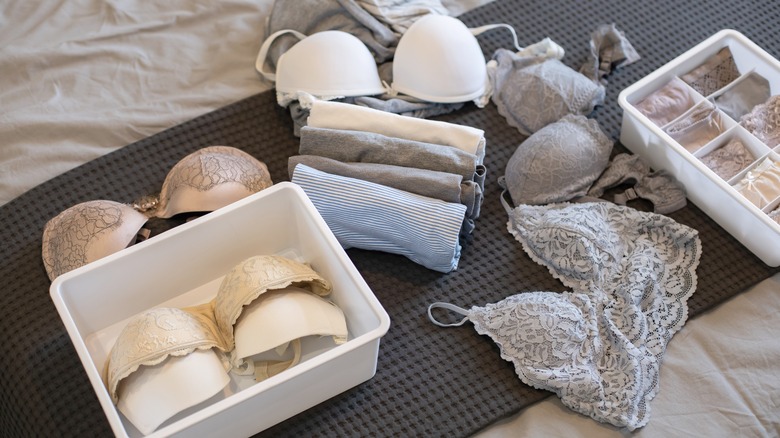 underwear and bras being organized in a drawer