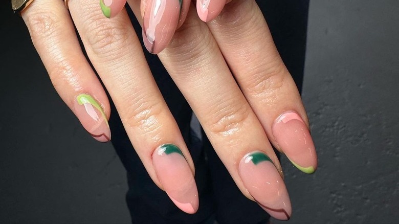 almond nails with green, pink, brown double-corner lines