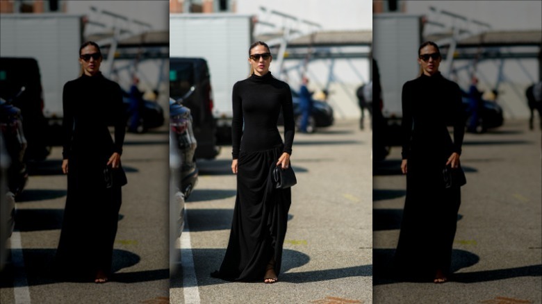 woman wearing black drop waist dress