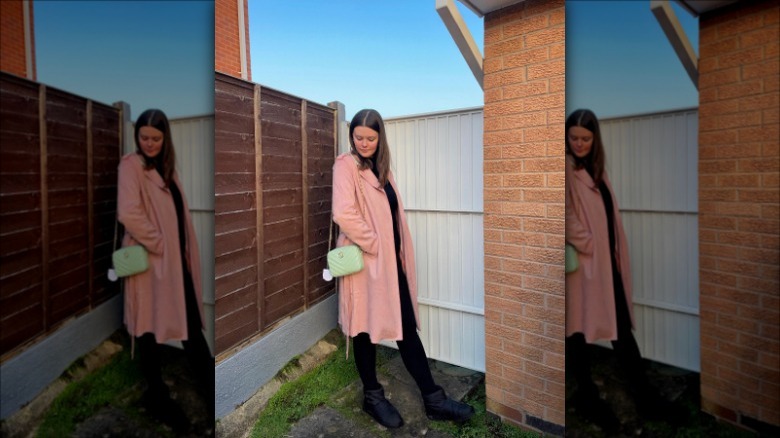 Pink coat and green purse