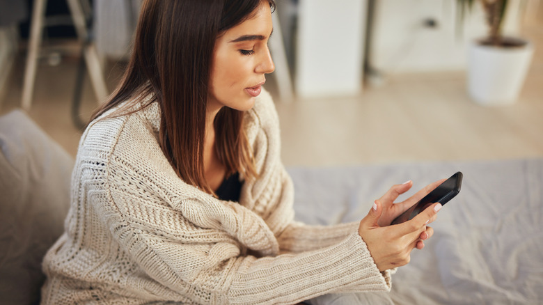 Woman looking at her phone