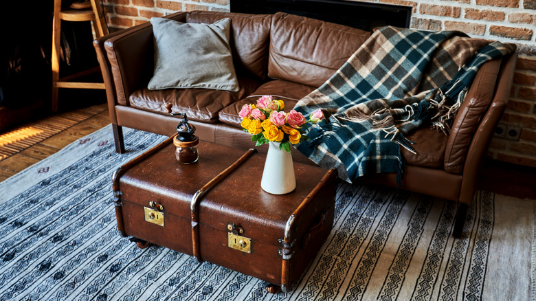 Brown leather sofa plaid throw blanket