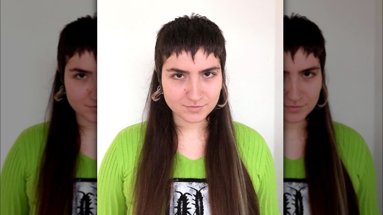 Woman models mullet with choppy bangs 