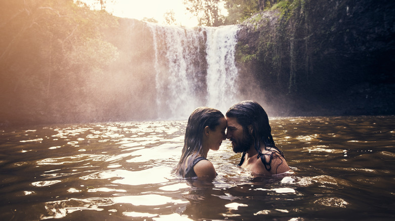 Couple under a waterfall