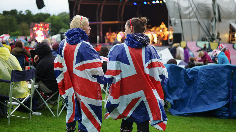 Wearing rain ponchos at outdoor concert