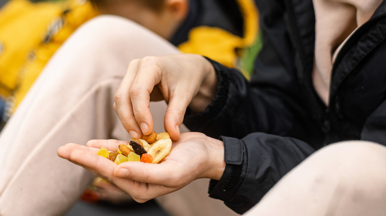 Woman eating trail mix