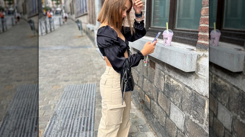 woman on street with smoothie