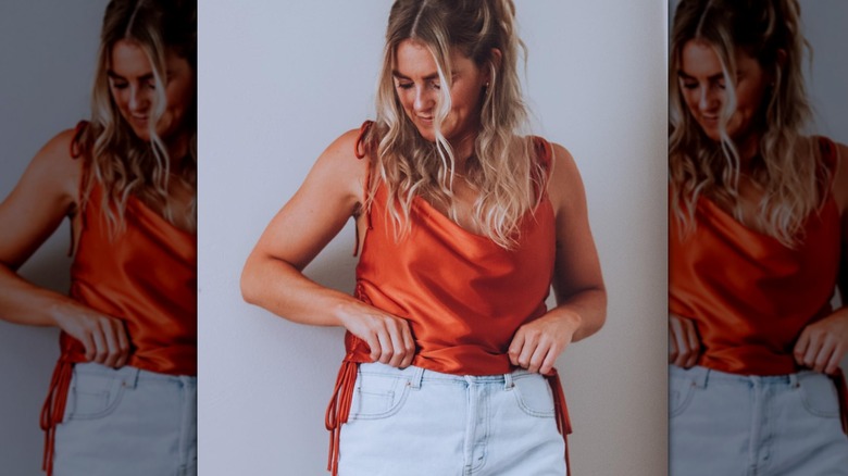 woman with orange tank