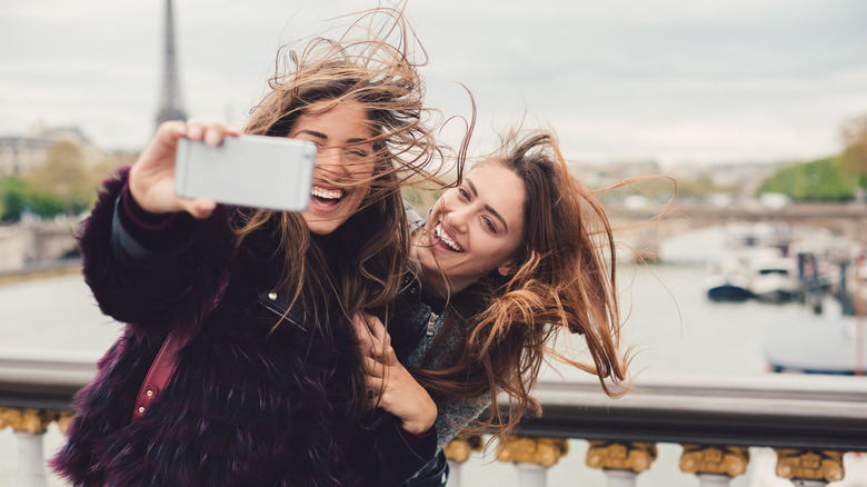 women taking picture in Paris