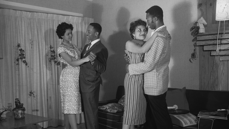 Two couples dancing in the 1960s