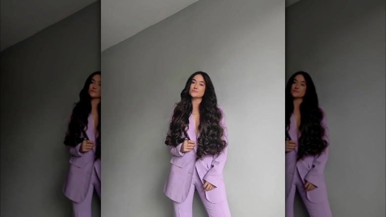 Girl wearing a lilac suit