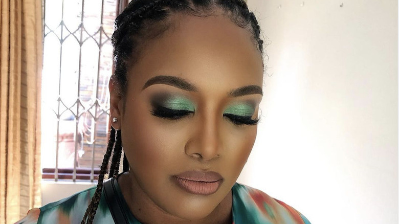 woman in sparkly green eyeshadow