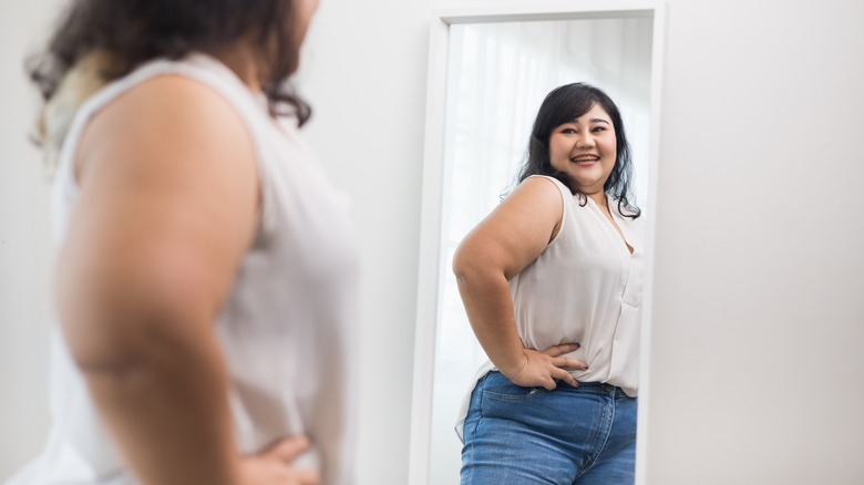 Woman smiling in mirror 