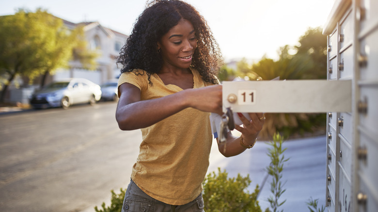 Woman checks mailbox