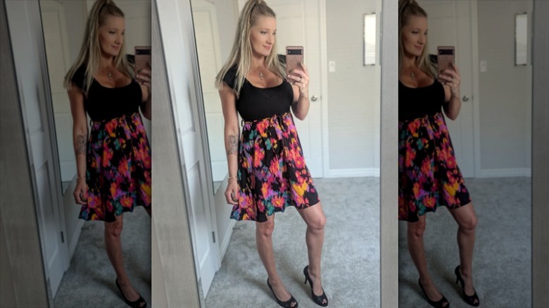 Blond wearing black floral dress