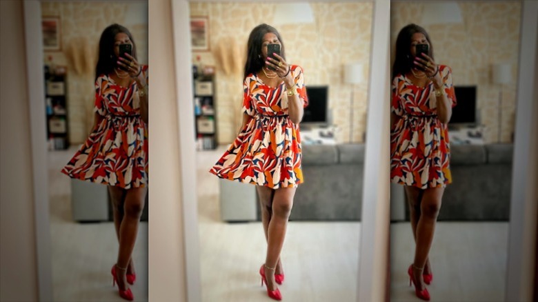 Woman wearing colorful belted minidress