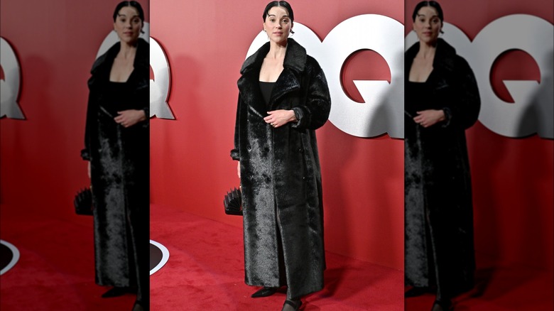 Woman wearing black faux fur coat