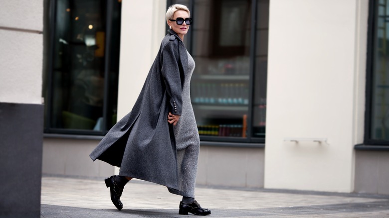 Woman wearing long gray woolen coat