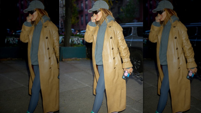 Woman wearing floor-length leather coat