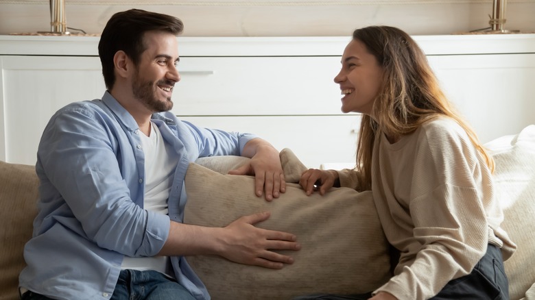 smiling couple on sofa