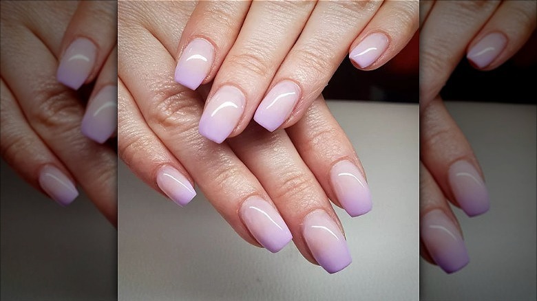 hands with purple french fade nails