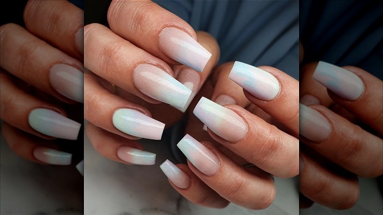 hands with light blue french fade nails