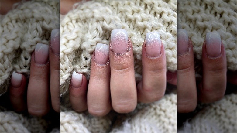 hands with glittery french fade nails