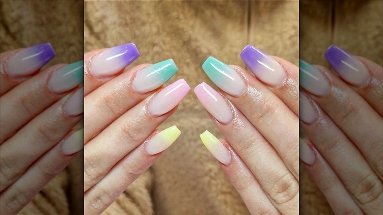 hands with multicolor french fade nails