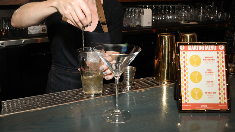 Bartender making martini