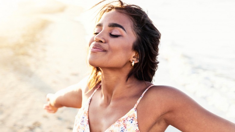 Woman smiling towards the sky