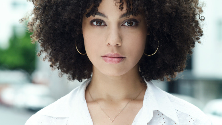 Woman wearing gold jewelry