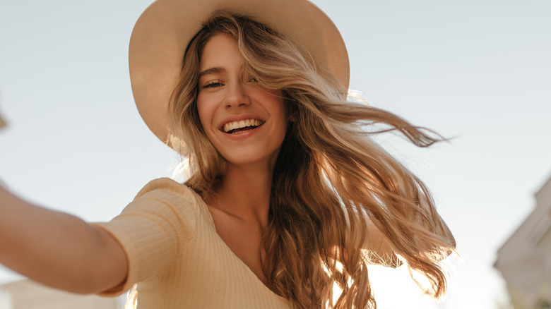 Blond woman in sun hat