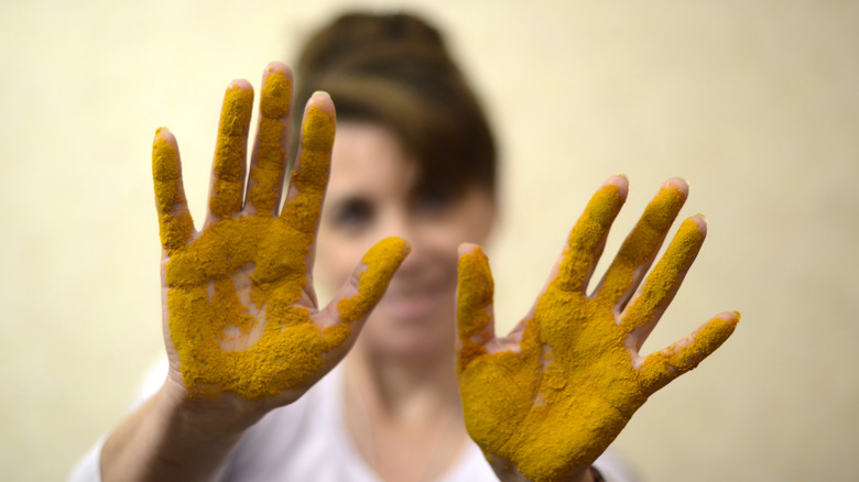 turmeric on palms