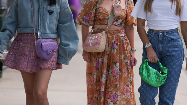 woman holding heart handbag