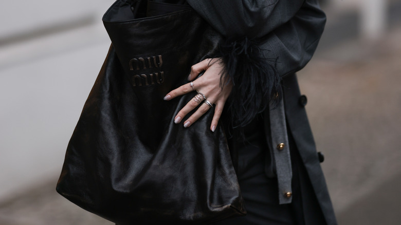 Trixi Giese with oversized handbag