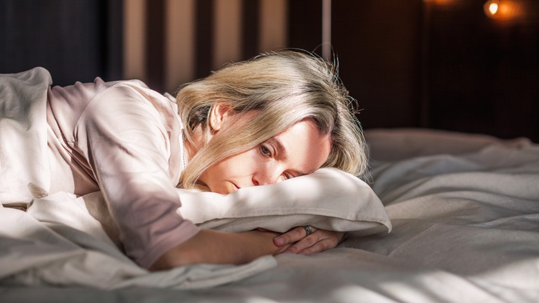 stressed woman can't sleep 