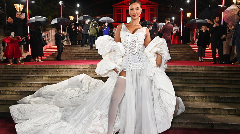 Woman wearing white corset dress