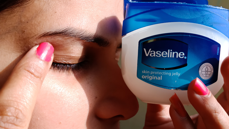 Girl using Vaseline on her eyelid